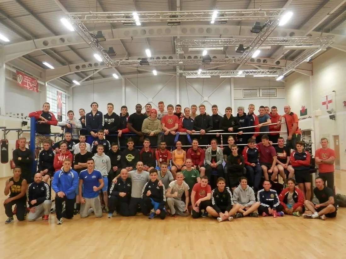 A full boxing squad around the ring after training